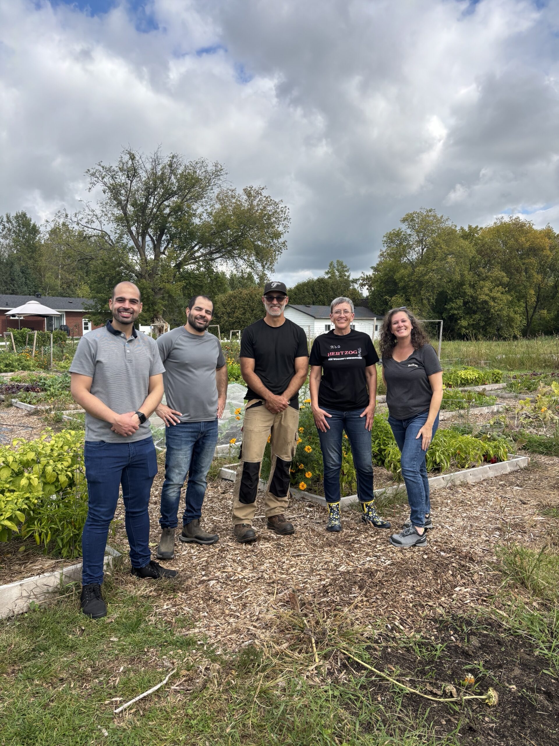 Visitors with Farmer Jay in the Thunder Gardens community garden